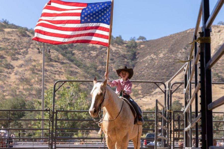 Bolado Park - Horse Show - child on a horse holding an American flag
